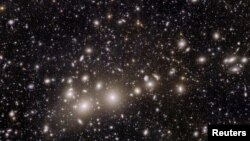 Galaxies belonging to the Perseus Cluster and others farther away are captured by the Euclid telescope, which was designed to explore the dark matter and dark energy that are thought to make up 95% of the universe. (European Space Agency via Reuters)