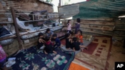 Palestinian children play in Khan Younis, Gaza Strip, June 10, 2024.