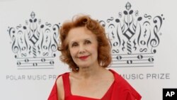 FILE - Composer Kaija Saariaho, of Finland, arrives for the Polar Music Prize ceremony, where she was named Polar Music Prize laureate Composer for 2013, at the Stockholm concert hall in Stockholm, Aug. 27, 2013.