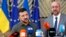 Ukrainian President Volodymyr Zelenskyy, left, and European Council President Charles Michel speak with the media as they arrive for an EU summit in Brussels, June 27, 2024.
