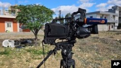 The damaged camera of Pan-Arab TV network Al-Mayadeen cameraman Rabih Maamari, who was killed in an Israeli strike, is seen at the Lebanese border village of Tair Harfa near the border with Israel, Nov. 21, 2023.