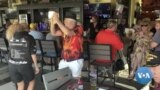 Michael Roche, (in black hat) and Denise Moline (in black), dance at an establishment in The Villages retirement community in Florida, Feb. 27, 2023.