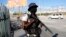 FILE - A National Police officer patrols an intersection in Port-au-Prince, Haiti, Jan. 26, 2024. After multiple delays and court challenges, it appears that the deployment of Kenyan police officers to Haiti may be set for June 25, according to reports. 