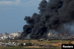 A smoke rises from the North Gaza, amid the ongoing conflict between Israel and the Palestinian Islamist group Hamas, as seen from Israel, Jan. 31, 2024.