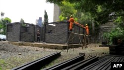 FILE - Workers work at the construction site of Kubik's first daycare building site in Addis Ababa, Ethiopia, on June 19, 2023.