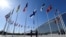 FILE - Finnish military personnel install the Finnish national flag at the NATO headquarters in Brussels, on April 4, 2023.