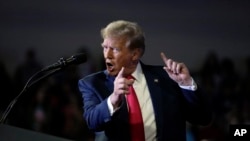 FILE - Republican presidential candidate former President Donald Trump speaks at a Get Out The Vote rally at Coastal Carolina University in Conway, SC, February 10, 2024. 