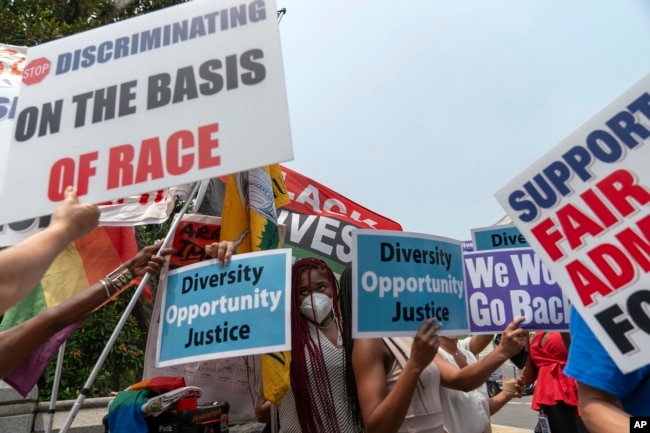 People protest outside of the Supreme Court in Washington, Thursday, June 29, 2023. The Supreme Court on Thursday struck down affirmative action in college admissions, declaring race cannot be a factor and forcing institutions of higher education to look for new ways to achieve diverse student bodies. (AP Photo/Jose Luis Magana)