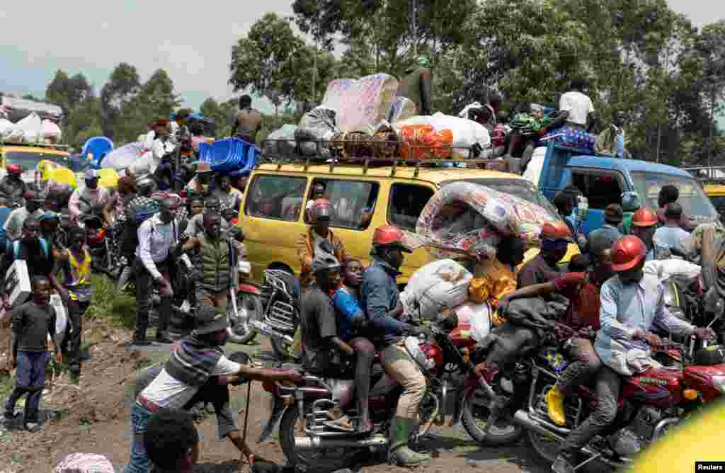 Congolese people flee from their villages around Sake in Masisi territory, following clashes between M23 rebels and the Armed Forces of the Democratic Republic of the Congo towards Goma, North Kivu province.
