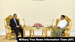 Senior Gen. Min Aung Hlaing, right, head of the military council, talks with former U.N. Secretary-General Ban Ki-moon, left, during their meeting, April 24, 2023, in Naypyitaw, Myanmar.