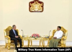 FILE - Senior Gen. Min Aung Hlaing, right, head of the military council, talks with former U.N. Secretary-General Ban Ki-moon during their meeting, April 24, 2023, in Naypyitaw, Myanmar.