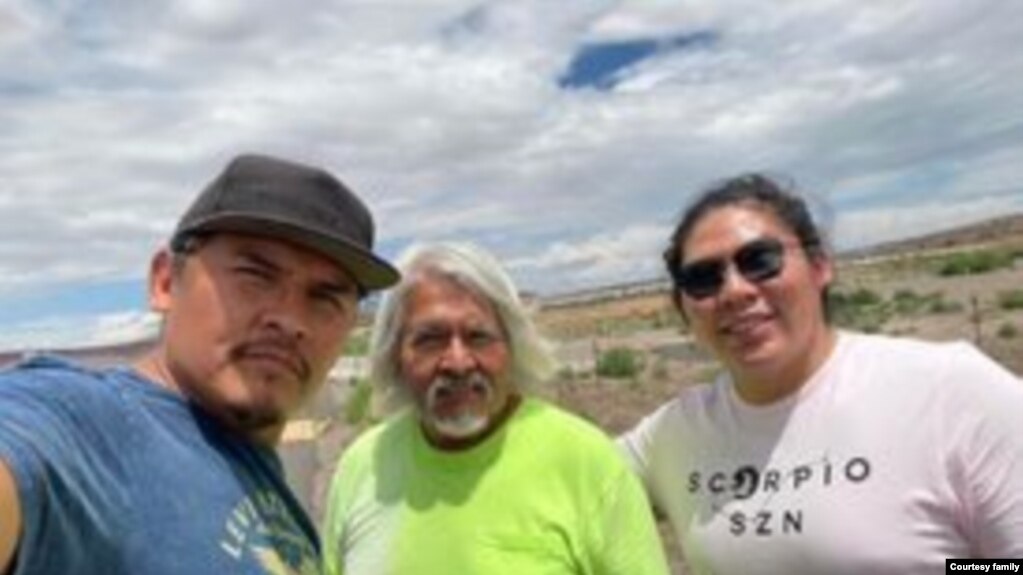 Three generations of Navajo silver artisans. Left to Right, Reggie Mitchell, father Eugene Mitchell and son Bronson Mitchell of Gallup, New Mexico.