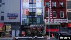FILE - A building housing an office described by U.S. authorities as a Chinese "secret police station" is seen in the Chinatown neighborhood of New York City, April 17, 2023. U.S. officials warn of a rise in foreign nations monitoring people they see as dissidents in the U.S.