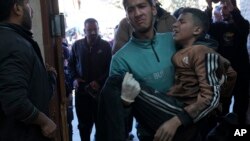 Palestinians wounded in the Israeli bombardment of the Gaza Strip are brought to a hospital in Deir al Balah, Gaza Strip, Feb. 17, 2024.