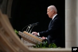 President Joe Biden speaks during a funeral service for retired Supreme Court Justice Sandra Day O'Connor at the Washington National Cathedral, in Washington, Dec. 19, 2023.