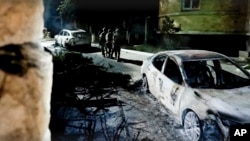 In this photo taken from video and released by Russia's National Antiterrorism Committee on June 24, 2024, FSB officers conduct a counter-terrorist operation in the republic of Dagestan, Russia, following deadly attacks by armed militants.