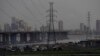 FILE - High-tension power lines pass through Makoko slum in Lagos, Nigeria, Aug. 20, 2022.