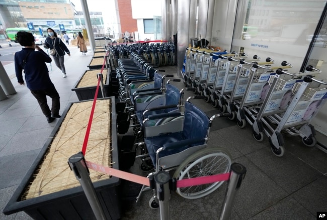 Wheelchairs are seen at Seoul National University Hospital in Seoul, South Korea, Tuesday, Feb. 20, 2024. (AP Photo/Ahn Young-joon)