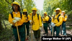 FILE: Wildland firefighter students from Alabama A&M and Tuskegee universities during firefighter training on Friday, June 9, 2023, in Hazel Green, Ala. in a partnership between the U.S. Forest Service and four historically Black colleges and universities.