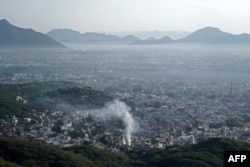 A general view of the city is pictured amid smoggy conditions during morning in Ajmer, India, Oct. 30, 2023.
