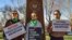 FILE - Three members of the Women's March group protest in support of access to abortion medication outside the Federal Courthouse, March 15, 2023 in Amarillo, Texas. 