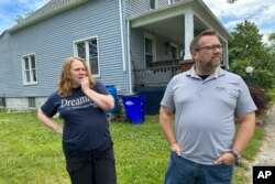Tanya and Jay Aho are interviewed outside their home, in Detroit, June 22, 2023.