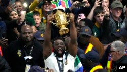 South Africa's Siya Kolisi holds the Webb Ellis trophy as fans welcome South Africa' Springbok team during their arrival at O.R Tambo's international airport in Johannesburg, South Africa, Oct. 31, 2023, after the Rugby World Cup.