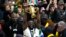 South Africa's Siya Kolisi holds the Webb Ellis trophy as fans welcome South Africa' Springbok team during their arrival at O.R Tambo's international airport in Johannesburg, South Africa, Oct. 31, 2023, after the Rugby World Cup.