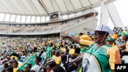 An African National Congress (ANC) supporter gestures at the (ANC) Election Manifesto launch at the Moses Mabhida Stadium in Durban on February 24, 2024.