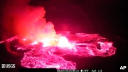 In this webcam image provided by the US Geological Survey, an eruption takes place on the summit of the Kilauea volcano in Hawaii, June 7, 2023.