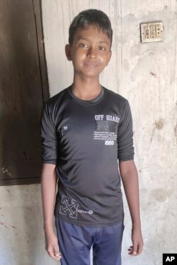 In this photo provided by the family, Rohingya refugee Muhammed Ansar, 14, poses for a photo on Nov. 20, 2023, the day he left his family's shelter in Bangladesh's refugee camps, to board a boat bound for Indonesia that now has been missing for weeks.