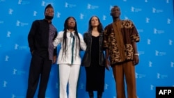 FILE - (From L) Benin Protagonist Habib Ahandessi, Benin Protagonist Josea Guedje, French director Mati Diop and Benin Protagonist and director assistant Gildas Adannou of the film "Dahomey" pose for a photo call at the 74th Berlinale film festival in Berlin on February 18, 2024.