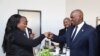 Botswana President Mokgweetsi Masisi, right, greets delegates at the U.S.-Africa Business Summit, July 12, 2023, in Gaborone, Botswana. (Mqondisi Dube/VOA)