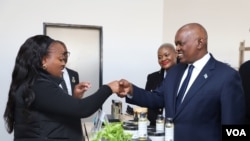 Botswana President Mokgweetsi Masisi, right, greets delegates at the U.S.-Africa Business Summit, July 12, 2023, in Gaborone, Botswana. (Mqondisi Dube/VOA)