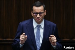 Polish Prime Minister Mateusz Morawiecki speaks during the first session of the newly elected Polish parliament in Warsaw, Poland, Nov. 13, 2023.