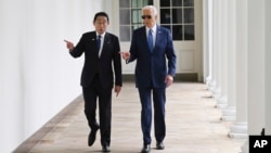 FILE - President Joe Biden and Japanese Prime Minister Fumio Kishida walk along the colonnade of the White House after a State Arrival Ceremony, April 10, 2024, in Washington.