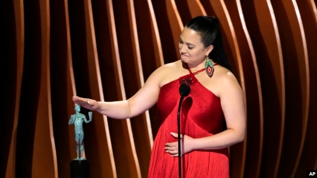 Lily Gladstone accepts the award for outstanding performance by a female actor in a leading role for 'Killers of the Flower Moon' during the 30th annual Screen Actors Guild Awards on Feb. 24, 2024, at the Shrine Auditorium in Los Angeles.