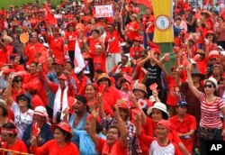 FILE - Pro-government Red Shirt members stage a rally in Bangkok, Thailand, April 5, 2014.