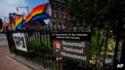 A National Park Service sign marks the Stonewall National Monument outside the Stonewall Inn, June 17, 2024, in New York. 