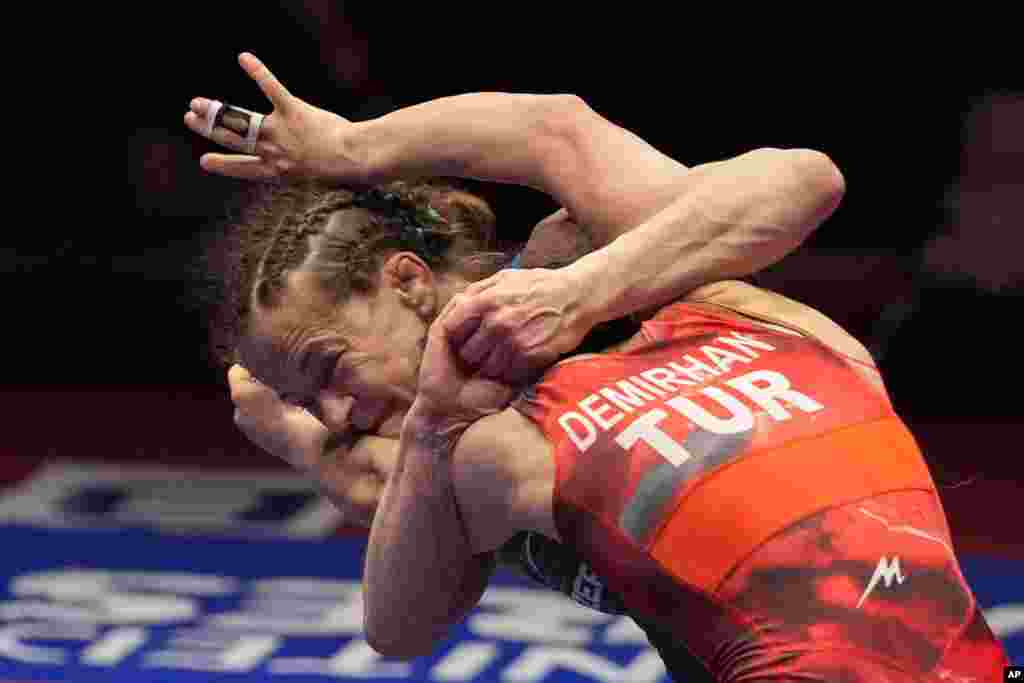 Azerbaijan&#39;s Mariya Stadnik, left, competes with Turkey&#39;s Evin Demirhan in a women&#39;s freestyle 50 kg category gold medal wrestling match during the European Wrestling Championships, in Bucharest, Romania.