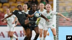 Nigeria's Halimatu Ayinde competes for the ball in front of Nigeria's Michelle Alozie and Ireland's Denise O'Sullivan during the Women's World Cup Group B soccer match between Ireland and Nigeria in Brisbane, Australia, July 31, 2023.