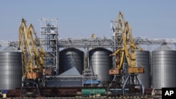 FILE - Exterior view of the grain storage terminal during visit of U.N. Secretary-General Antonio Guterres at the Odesa Sea Port, in Odesa, Ukraine, Aug. 19, 2022.