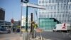 Flowers are attached to a pole where a young man was killed by a police officers, June 28, 2023 in Nanterre, France.