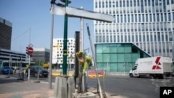 Flowers are attached to a pole where a young man was killed by a police officers, June 28, 2023 in Nanterre, France.