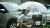 A person walks in the rain in Tokyo, Aug. 30, 2024. Tropical Storm Shanshan brought torrential rain to parts of Japan over the weekend.