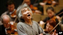 FILE - Former Director of the Boston Symphony Orchestra Seiji Ozawa conducts the orchestra during a rehearsal of Berlioz's "Symphonie Fantastique," at Symphony Hall, in Boston, on Nov. 26, 2008.