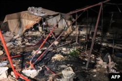 This picture taken late on Sept. 23, 2023 shows a view of a burnt tent shelter in the aftermath of Syrian government forces' bombardment at a camp for those displaced by conflict in Sarmin in the rebel-held part of Syria's northwestern Idlib province.