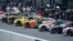 Pit crew members work on race cars during qualifying for the Grant Park 220 NASCAR Cup Series Race, July 1, 2023, in downtown Chicago.