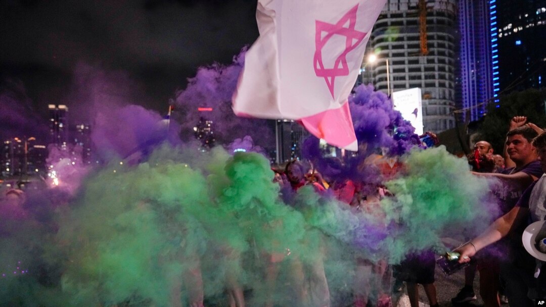 Demonstrators block a highway during a protest against plans by Prime Minister Benjamin Netanyahu's government to overhaul the judicial system, in Tel Aviv, Israel, July 8, 2023.