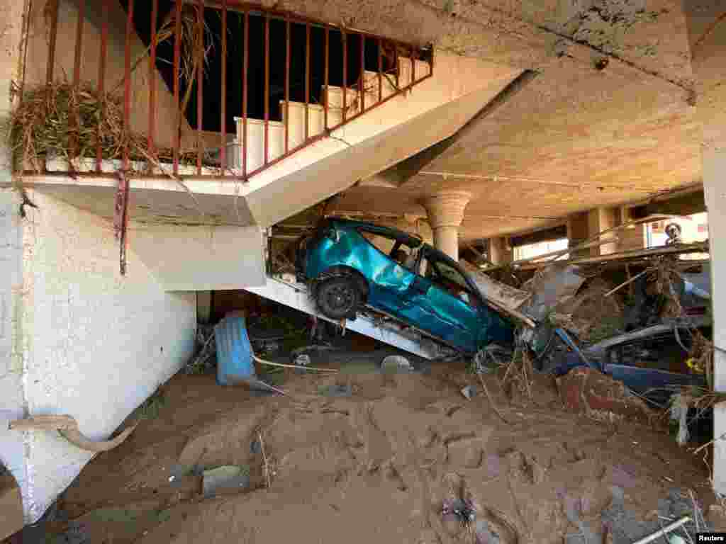 A view shows a damaged car, following a powerful storm and heavy rainfall hitting the country, in Derna, Sept. 13, 2023.